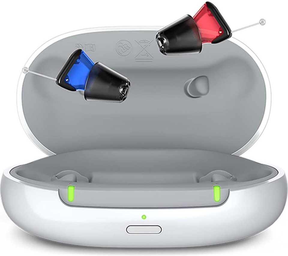 Signia in-the-ear IX hearing aids beside their charging case
