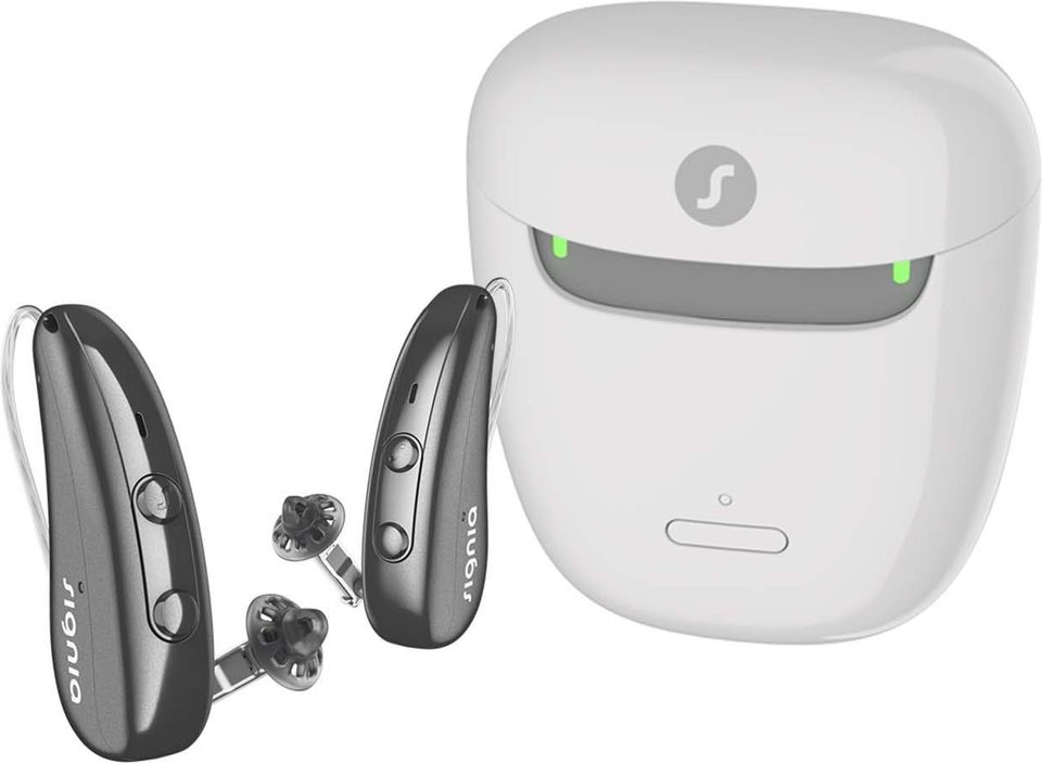Signia Pure Charge&Go IX receiver-in-canal hearing aids beside their charging case