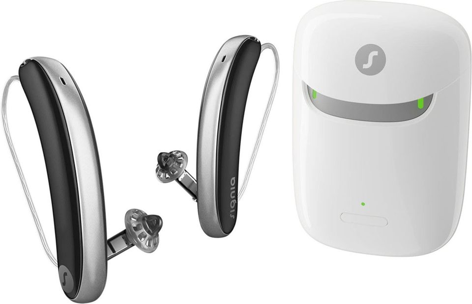 Signia Styletto IX slim receiver-in-canal hearing aids beside their charging case